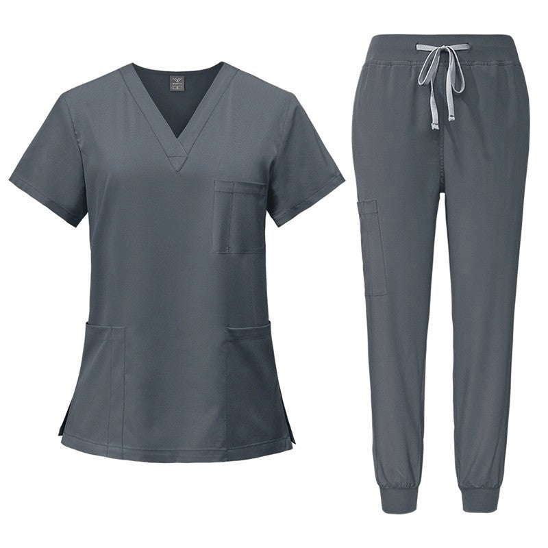 Gray scrub set with top and pants on a white background
