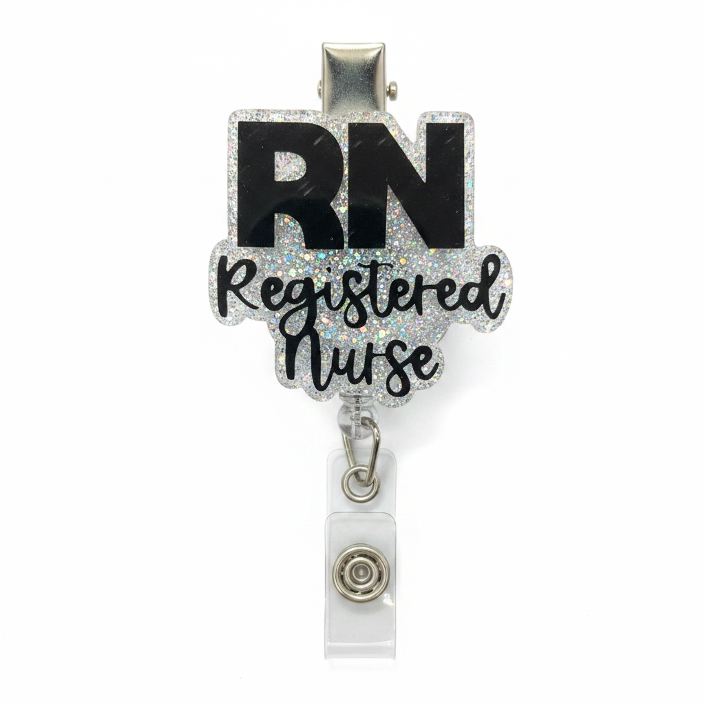 A retractable badge reel featuring a decorative charm with the text 'RN Registered Nurse' in black lettering over a silver glitter background, attached to a clear plastic clip with a silver metal snap.